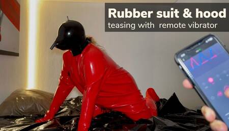 Horny girl in rubber suit with remote vibrator