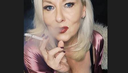 Smoker MILF wrapped in beautiful pink satin sucks her cork powerfully