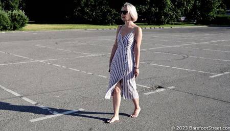 Beautiful blonde Anastasia walks barefoot in the hot summer city (Part 1 of 3) #20230225