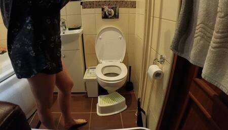 Only dressed up in men's shirt on toilet