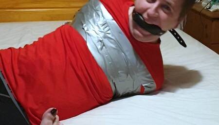 Man duct taped tight on bed in leggings 1-BBW domination,BBW Bondage,man in Bondage,male bondage,amateur,man tied up,bound and gagged man,tape bondage,duct tape,duct taped,taped up,leggings,feet,socks,struggling,gay bondage,