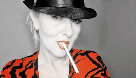 Smoker Queen Joan takes a pleasurable drag on her 120 Eve, many open mouth inhalations with lots of creamy white smoke surrounding her red lips*hat fetisch*red lips*close up*special filter*