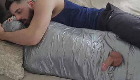 Bearded dom using mummified boy as a toy