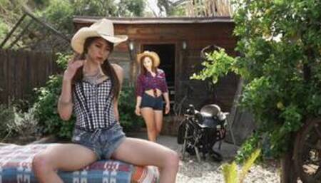 Abella D and Riley R in a cowgirl outdoor lesbian scene together
