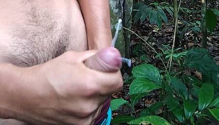 Horny young man fulfills his fantasies by touching himself in the woods, he gets horny and his milk is thick