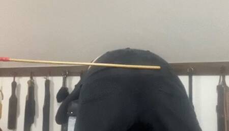 A caning over trousers, pants then the bare