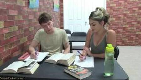 Alex C and Athena F next to & also on a grey coloured sofa in lesbian vampire scenes