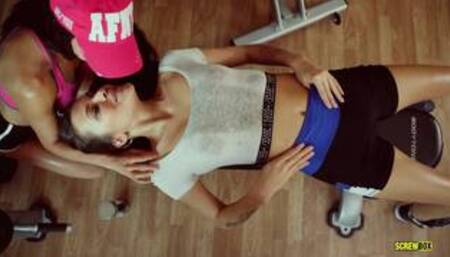 Alexa T and Verona S inside a gym in a lesbian workout scene together