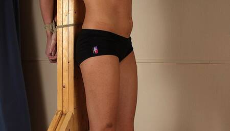 Cleavegagged topless barefoot Gloria in only black panties, bound to the wooden post, is being played with her friend (HD MP4)