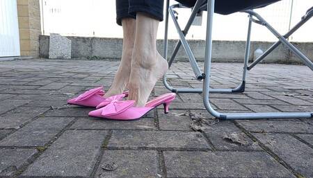 Skinny feet dangling and dropping woman fuchsia mules (avi)