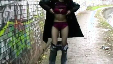 Redhead girl is being filmed while pissing at public places