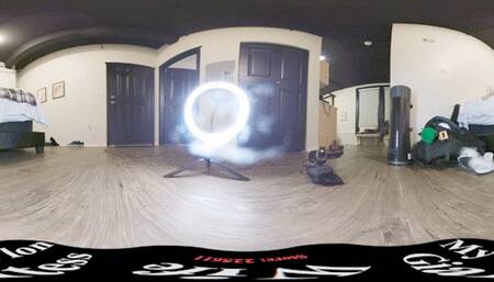 Putting on her green tights on the bed