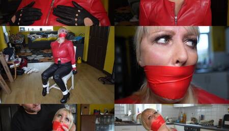Big busy blonde milf in leather bondage - Chair tied and tape gagged (mp4)