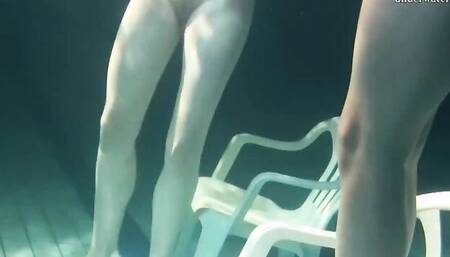 Mihalkova and Siskina are filmed underwater while swimming around naked
