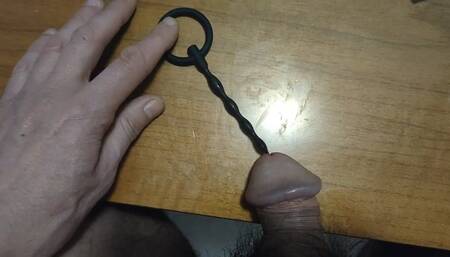 Urethral insertion with a small penis plug all the way in (avi)