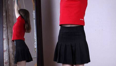 Agnes: barefoot girl in red top and black skirt, tied up standing on her toes with her hands tied up high above, wiggles on the floor at the mirror (HD MOV)