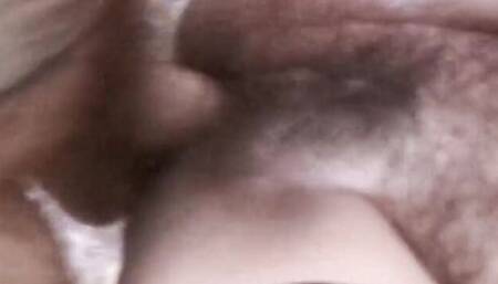 Mature woman sucks a cock and takes it in her hairy pussy