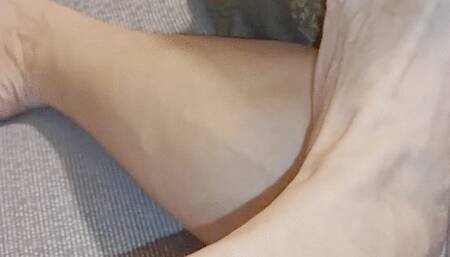 Barefoot on hotel couch