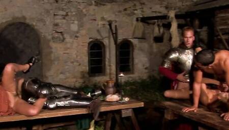 Three babes are fucked by horny knights in a dirty dungeon