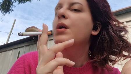 Beautiful italian milf smoking a cigarette in the garden in a sensual way 720HD