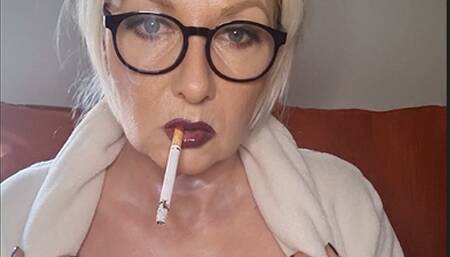 Enjoyable power smoke of a Marlboro Red 100 after my morning shower in my robe