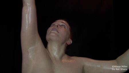 Standing and Stretched With My Arms Tightly Above My Head, and Covered In Oil