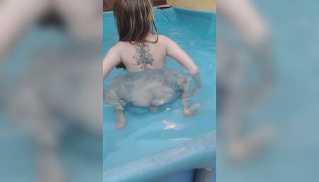 Riding a dildo in the pool