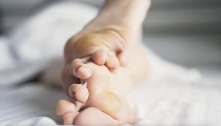 Callused feet relax in bed (720p)