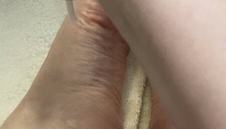 Rubbing Lotion on Feet