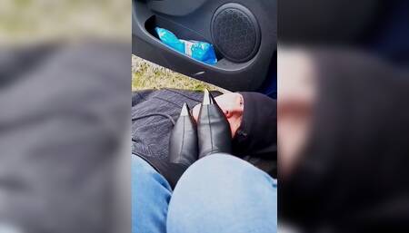 Leather boot licking in the car