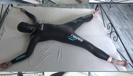 Spread-Eagle in a neoprene catsuit