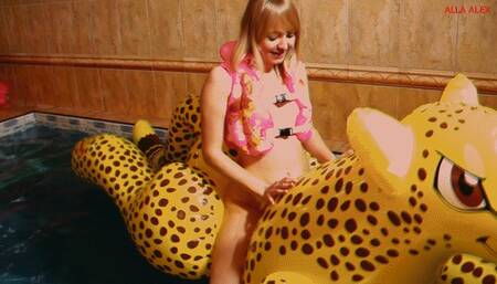 Alla has a hot fuck with a big inflatable cheetah in the pool and wears an inflatable vest for safety!!!