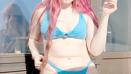 Smoking in a blue bikini