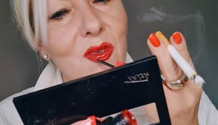 Stepmummy makes up her lips with glossy red lipstick while smoking a cork*OMI's*French Inhale*Close up sequences*cheek cavities pull