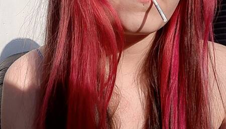 Smoking and sucking on a lollipop