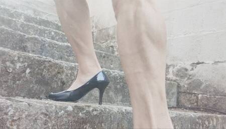 On basement stairs in stiletto