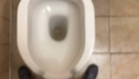 Peeing in a public toilet with flabby balls