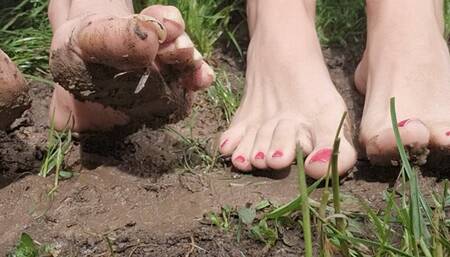 Goddess Samariel and Mistress Long Toenails foot worship in the mud