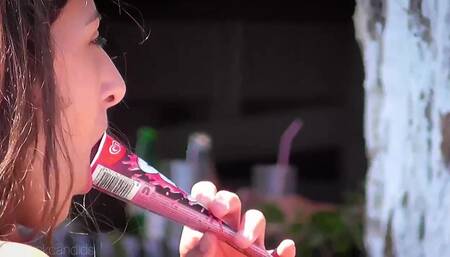 young teen sucking ice pop