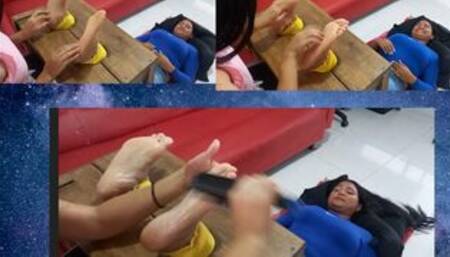 Nola tickles Lalita's soles