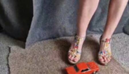 Abby completely destroys a 1964 Pontiac GTO in summer wedges upper side view