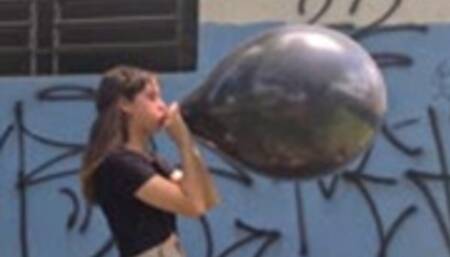 Katie Blows to Pop a Black SR 16"