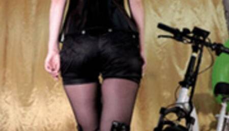 Biker girl deflates an inflatable ring