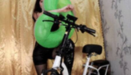 Biker girl inflates an inflatable ring