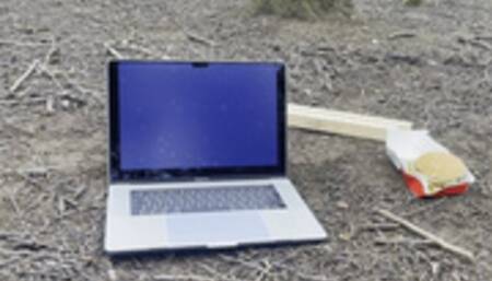 Another mac book with food destroyed with boots