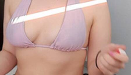 Smoking in a pink bikini