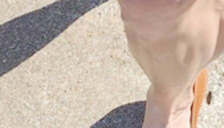 Walking in tan leather wedges