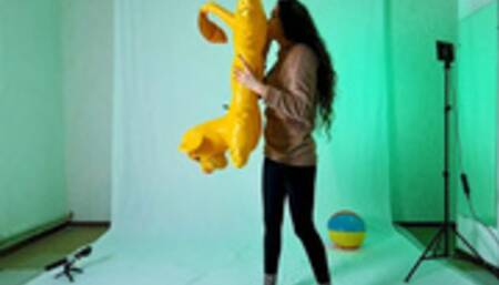 Liya inflates toys with her mouth 2023