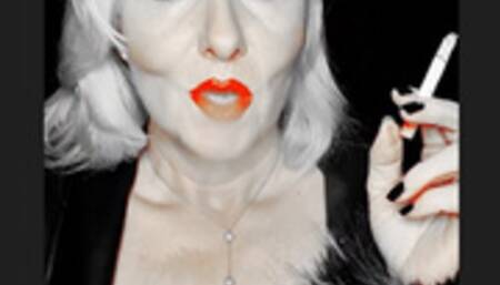 Smoker queen Joan pulls her marlboro red 100 very closly so sexy between her bright red juicy lips that glows just like her red bra