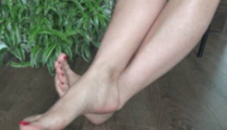 rubs feet crossed at the ankles 7HT